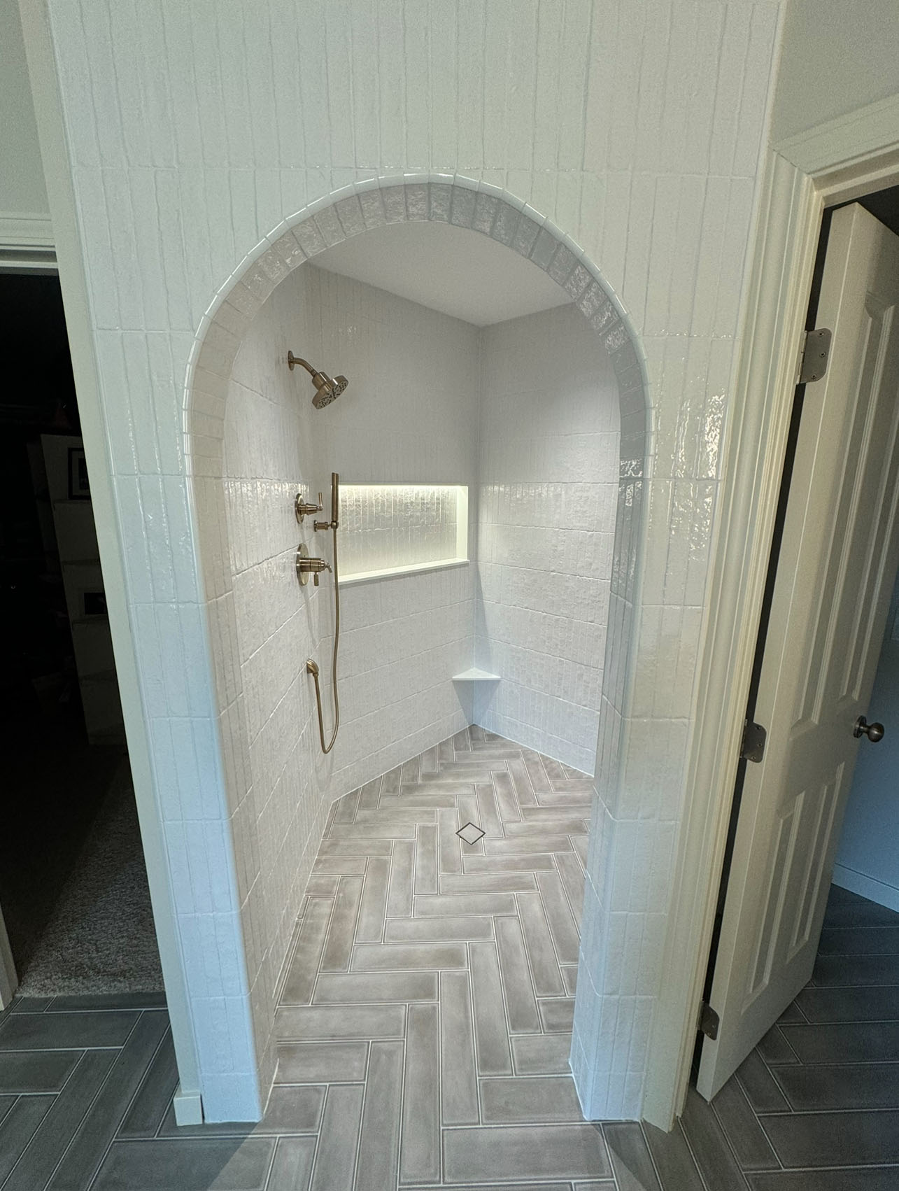 Tiled archway with herringbone floor